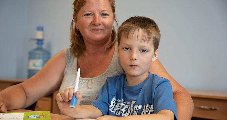 Portrait of mother and son benefit from the psychological support provided by SOS Children