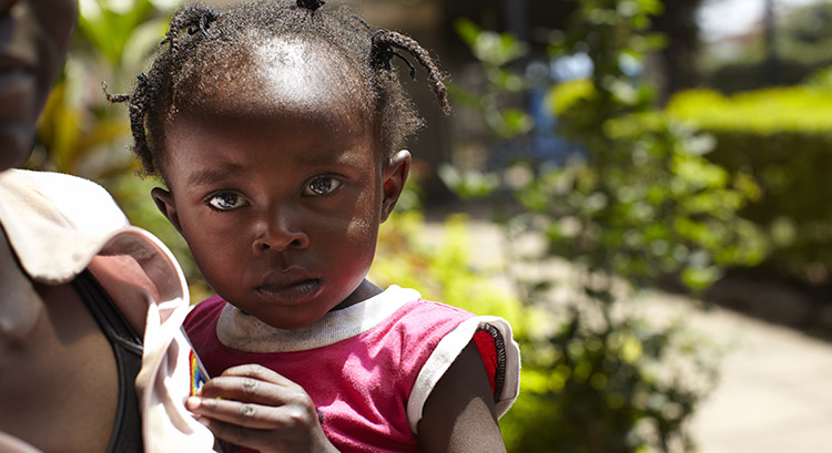 Girl and her mother waiting to be treated at the SOS medical centre