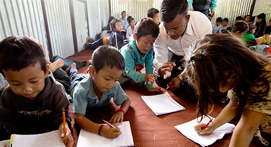 Children attending class in the makeshift schools.